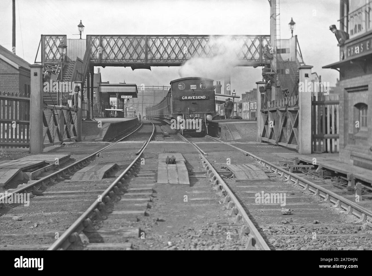 The railway station at Grays, Essex, England, UK c. 1910. Waiting at the station is a London, Tilbury and Southend Railway train headed east, destined for Gravesend. The tank engine at the front is locomotive number 21. The London, Tilbury and Southend Railway (LTSR) is a commuter railway line on the British railway system which connects London's Fenchurch Street station with destinations in east London and Essex. A loop line between Barking and Pitsea provides an alternative route via Grays and Tilbury. Stock Photo