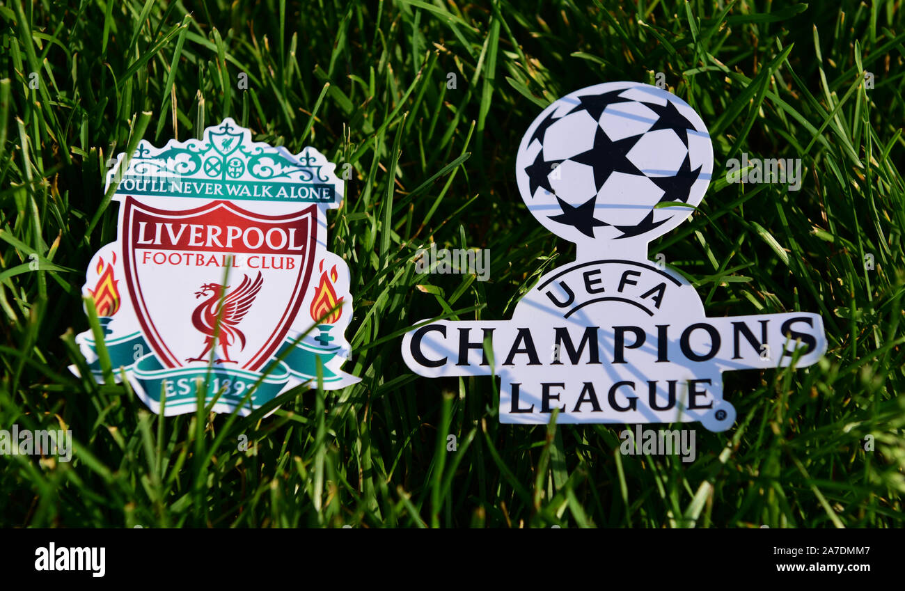 September 6, 2019 Istanbul, Turkey. The emblem of the English football club Liverpool next to the logo of the Champions League on the green grass of t Stock Photo