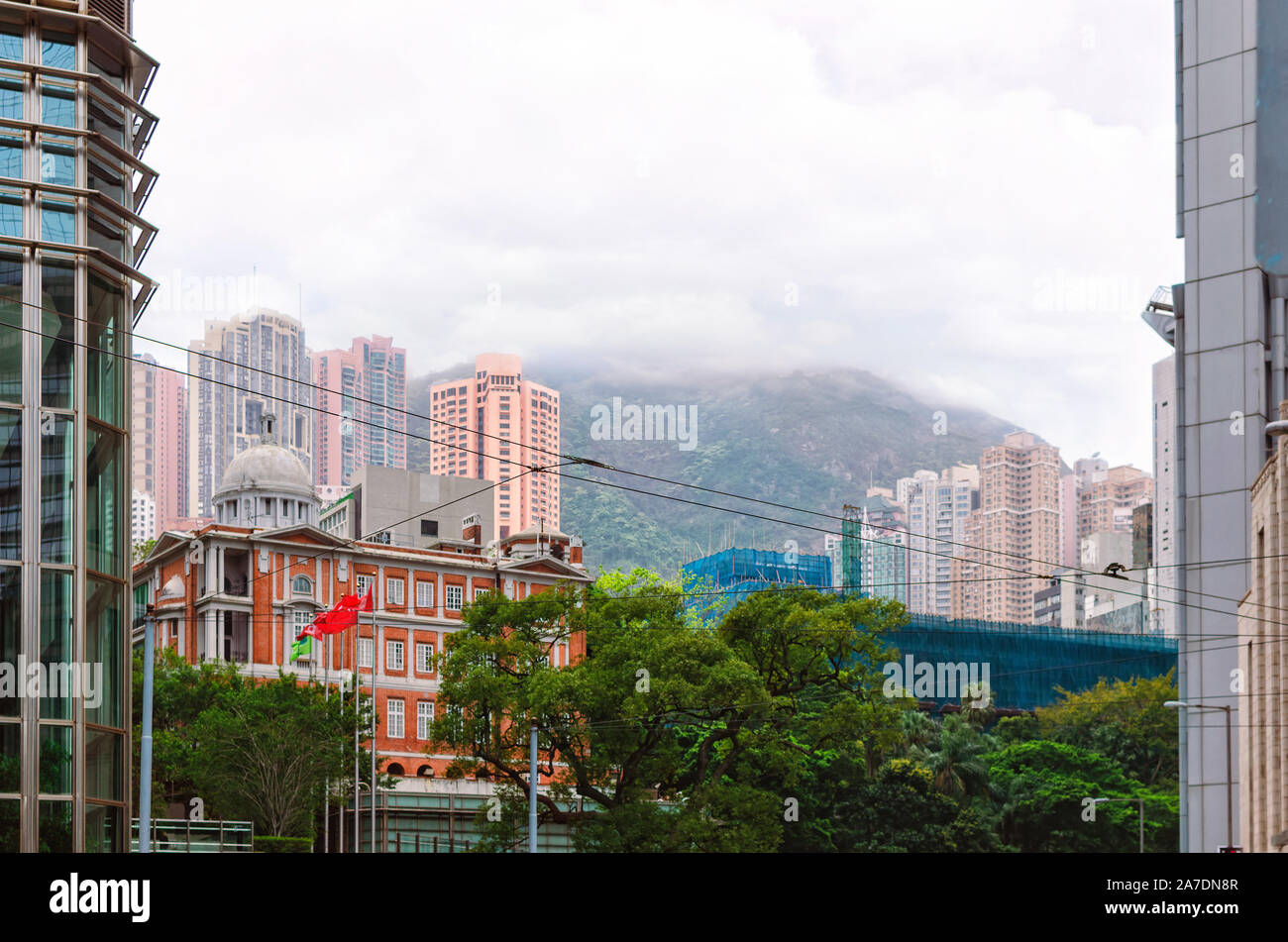 Hong Kong architecture in harmony with nature. Skyscrapers of the central Kowloon street.  Legislative Council Building Stock Photo