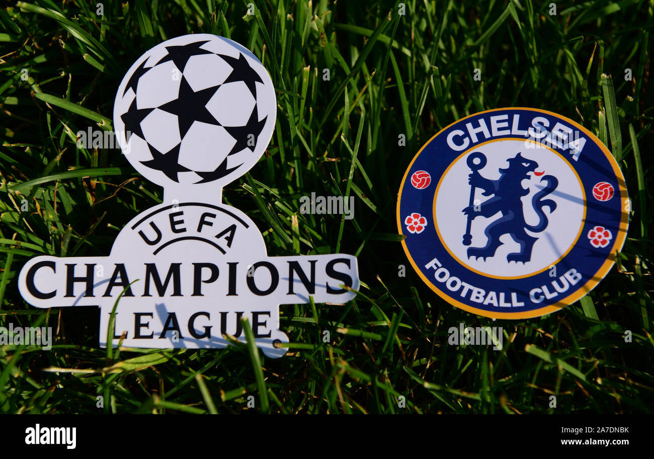 September 6, 2019 Istanbul, Turkey. The emblem of the English football club Chelsea London next to the logo of the Champions League on the green grass Stock Photo