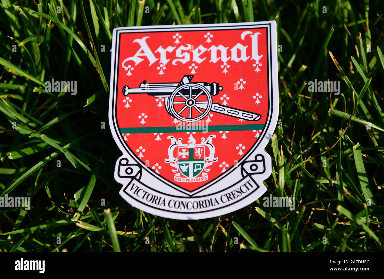 September 6, 2019 Istanbul, Turkey. The emblem of the English football club Arsenal London League on the green grass of the football field. Stock Photo