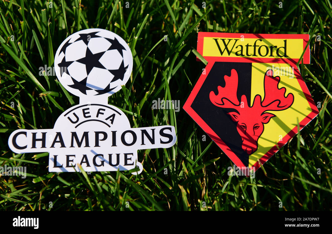 September 6, 2019 Istanbul, Turkey. The emblem of the English football club Watford next to the logo of the Champions League on the green grass of the Stock Photo
