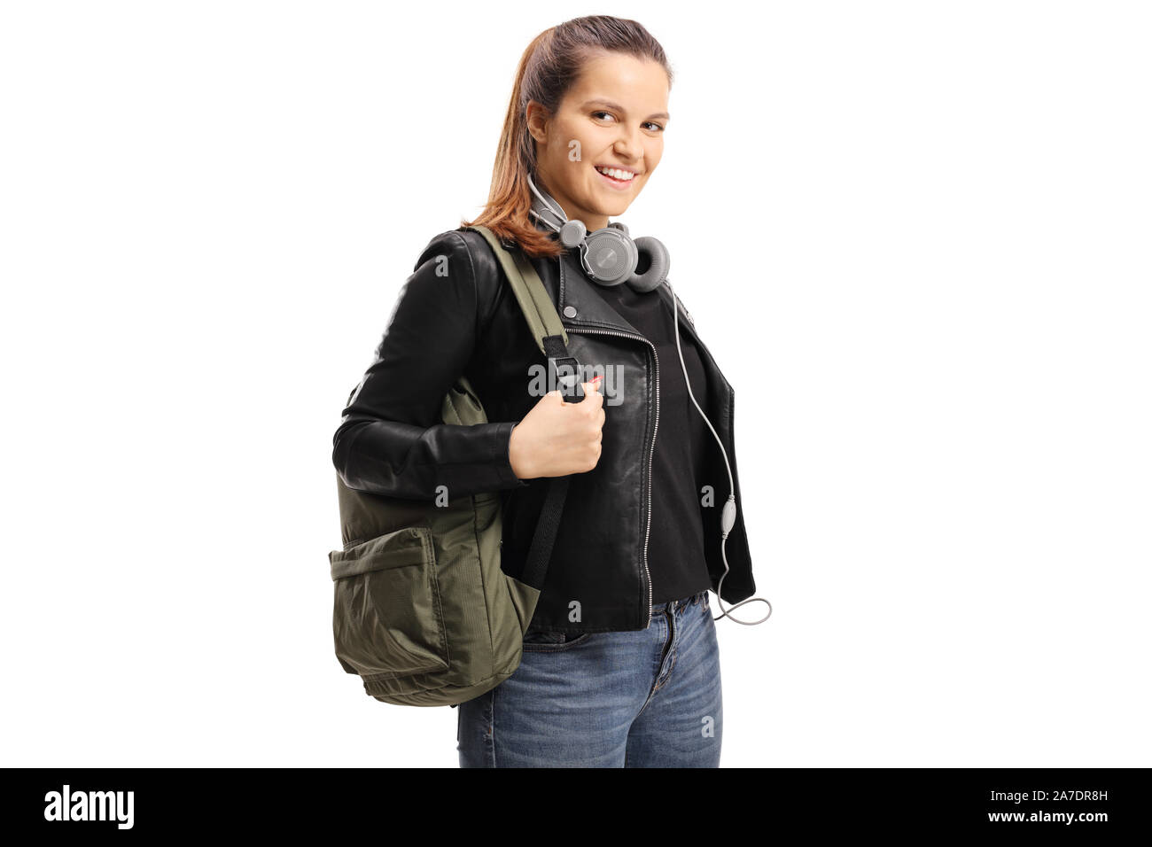 Female student with a backpack and headphones aroung her neck isolated ...