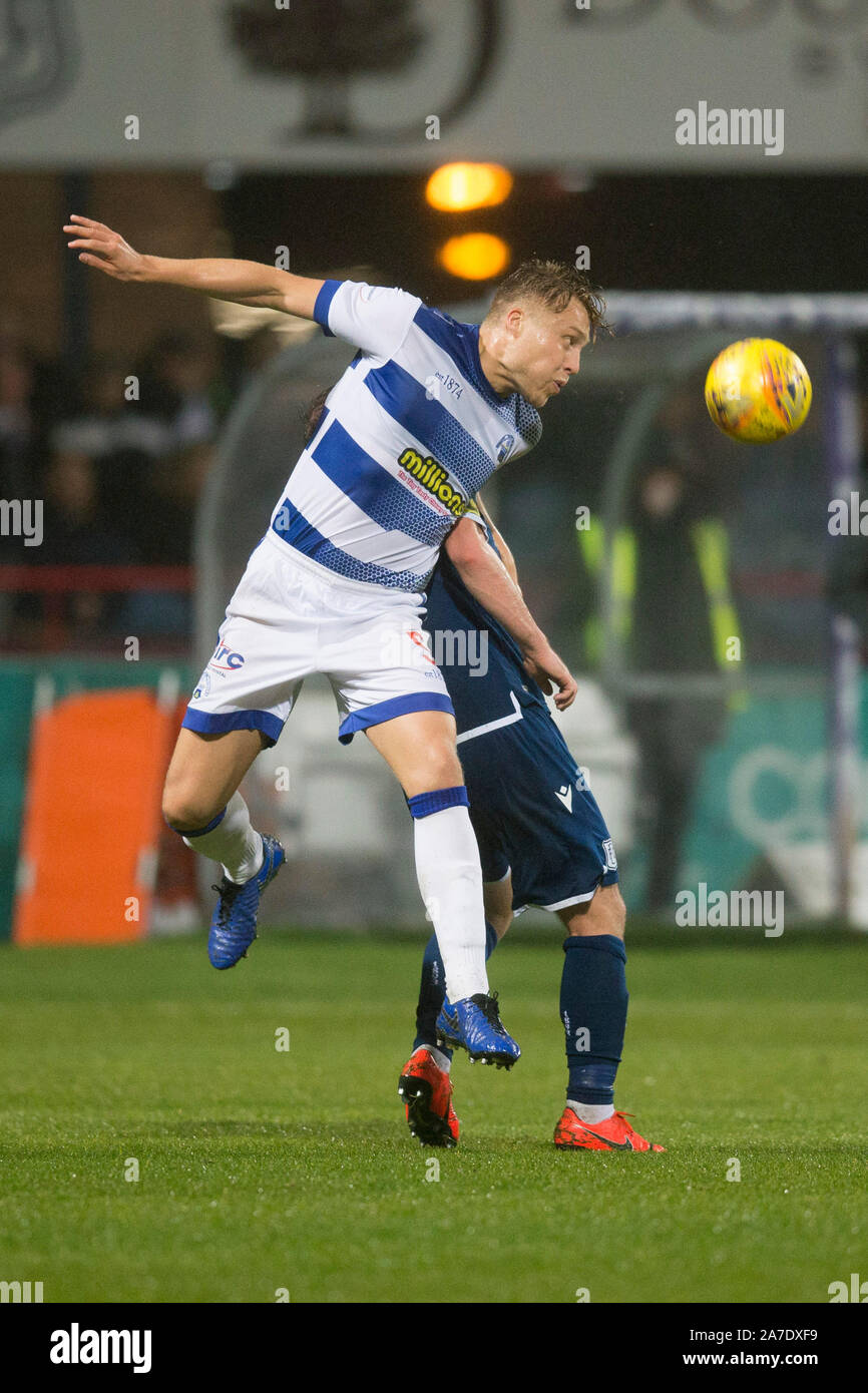 Dens Park, Dundee, UK. 1st Nov, 2019. Scottish Championship Football, Dundee Football Club versus Greenock Morton; Peter Grant of Greenock Morton clears from Paul McGowan of Dundee - Editorial Use Credit: Action Plus Sports/Alamy Live News Stock Photo