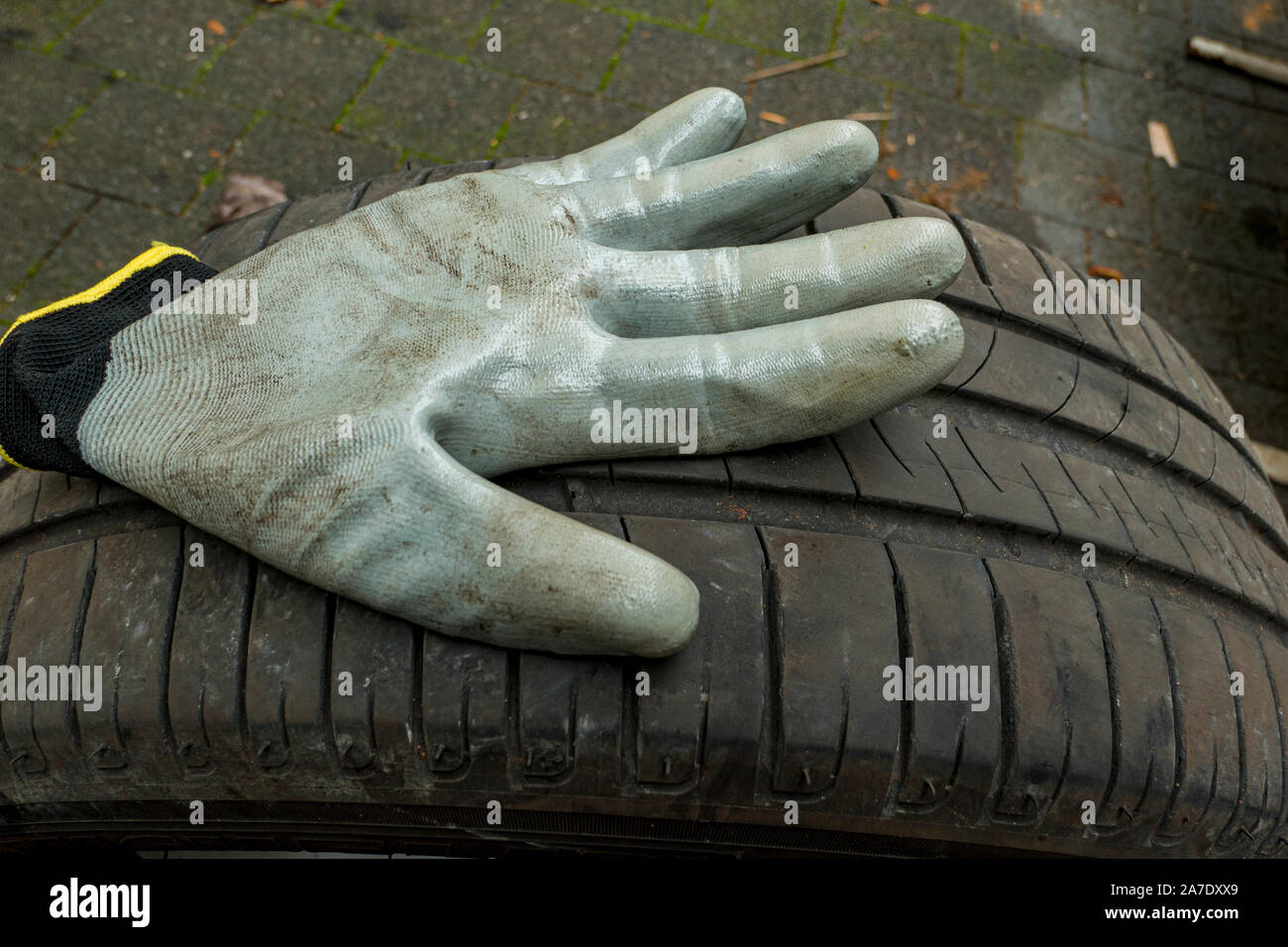 Glove for changing tires on a car tyre Stock Photo Alamy