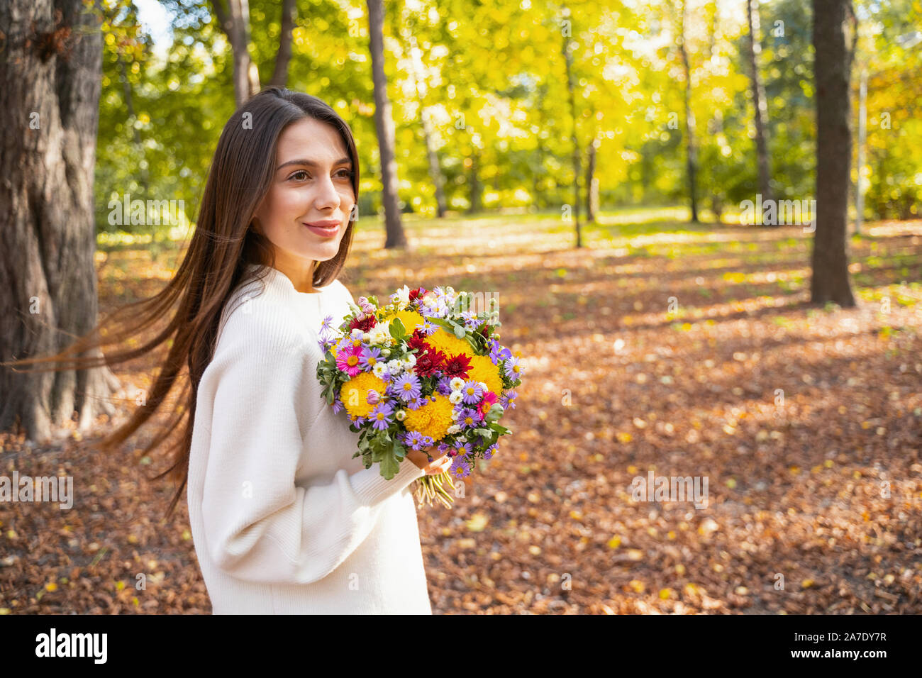 Beautiful lady being glad receiving flowers on her date Stock Photo