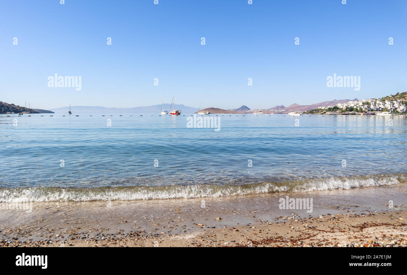 Beautiful calm blue bay with sand beach in Mediterranean. Holiday and relaxation on sea coast Stock Photo