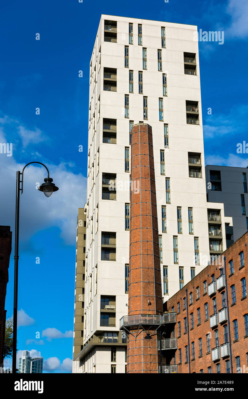 The Cambridge Street apartment block and an old factory chimney