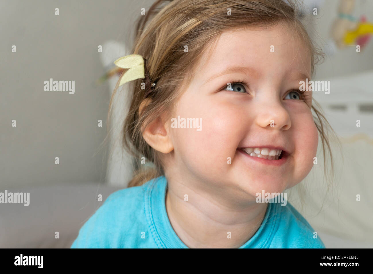Portrait of laughting little kid girl at home Stock Photo