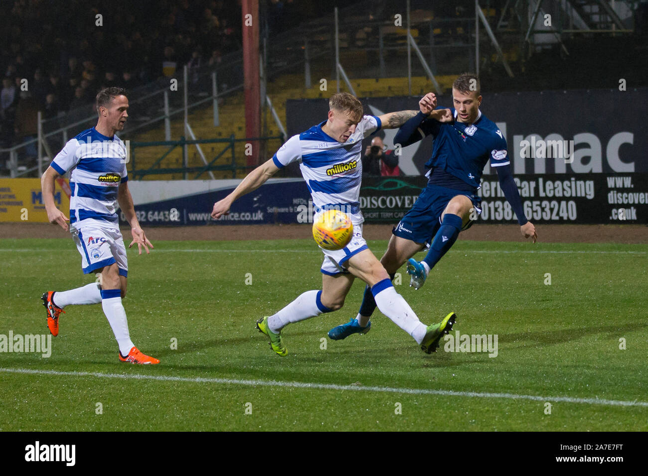 Dens Park, Dundee, UK. 1st Nov, 2019. Scottish Championship Football, Dundee Football Club versus Greenock Morton; Andrew Nelson of Dundee gets in a cross despite the effort of Cameron Salkeld of Greenock Morton - Editorial Use Credit: Action Plus Sports/Alamy Live News Stock Photo