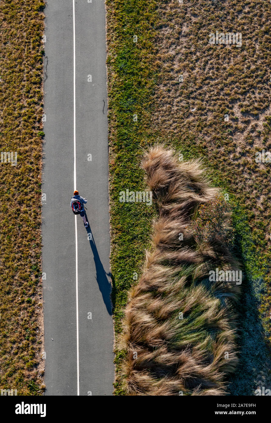 Aerial view over Canberra, ACT, Australia of scooter rider. Taken from