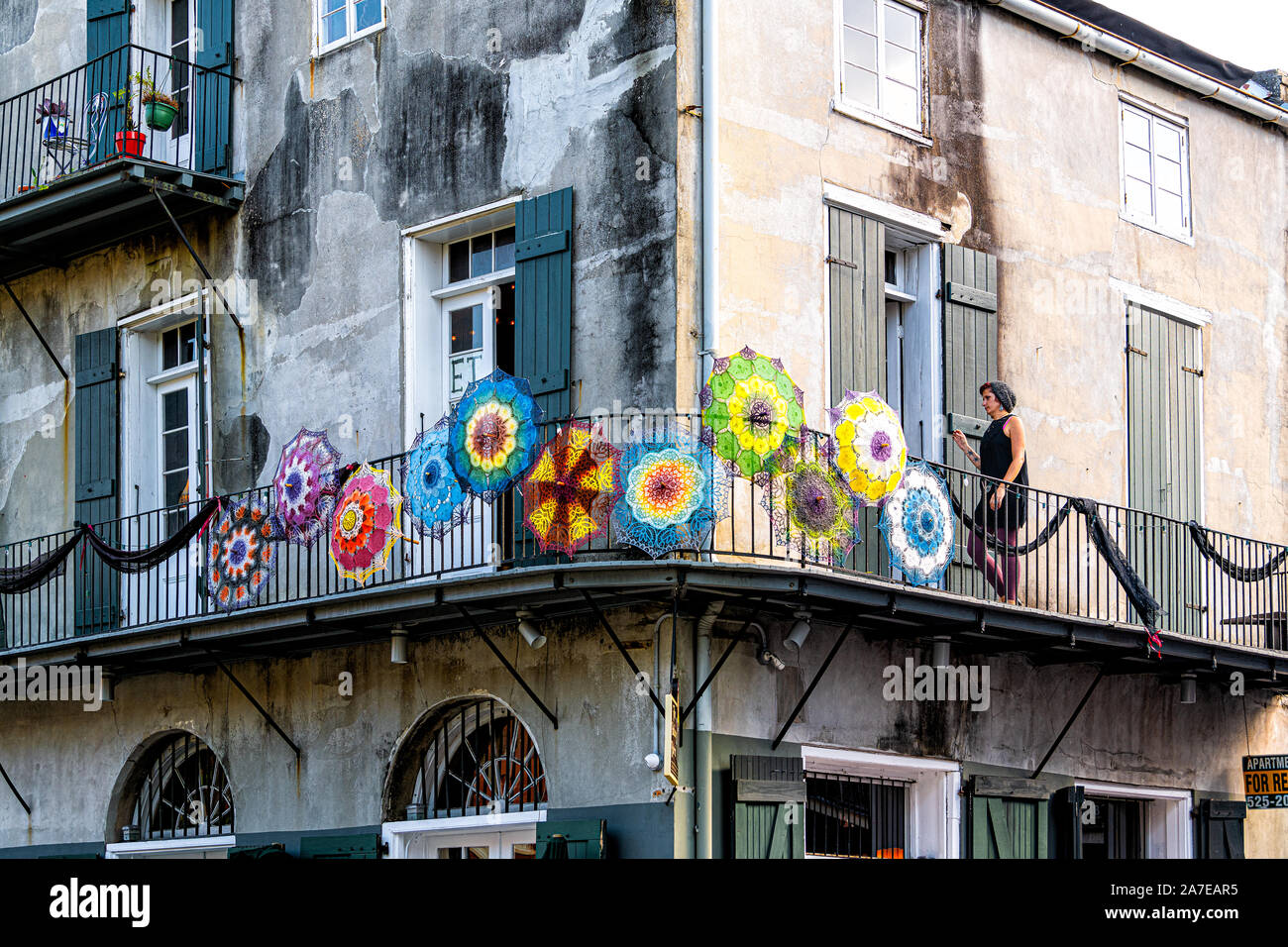 New Orleans, USA - April 23, 2018: Antique store with colorful design vintage umbrellas on balcony street in Louisiana city Stock Photo