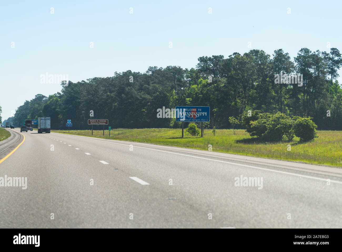 Pearlington, USA - April 24, 2018: Welcome to Mississippi sign with cars on road highway interstate i10 at border with Louisiana Stock Photo
