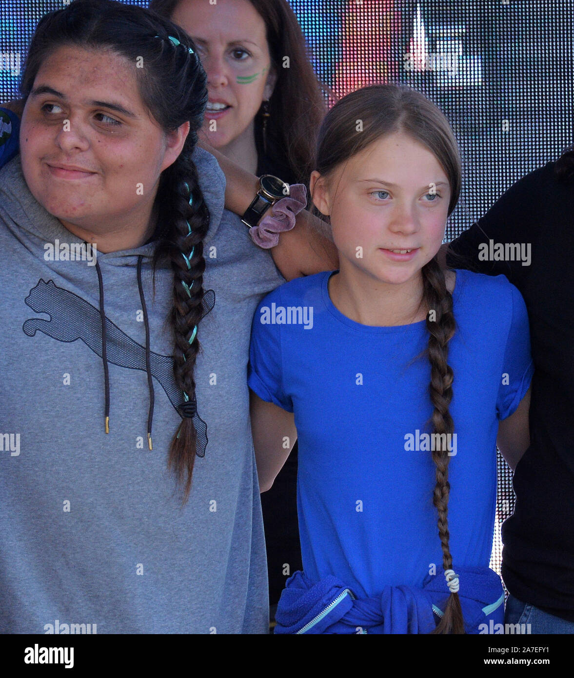 Los Angeles, USA. 1st Nov 2019. Swedish teen climate activist Greta Thunberg appears on stage with organizers of Youth Climate Strike Los Angeles, joining with protesters in a demonstration outside Los Angeles City Hall to protest fossil fuel production in California on Friday, November 1, 2019. Thunberg, 16, said her generation has a responsibility to demand from.elected officials environmental policy reforms that ban oil and gas drilling, from which carbon emissions have been identified as a primary source of the planet's annual rising temperatures. Credit: UPI/Alamy Live News Stock Photo