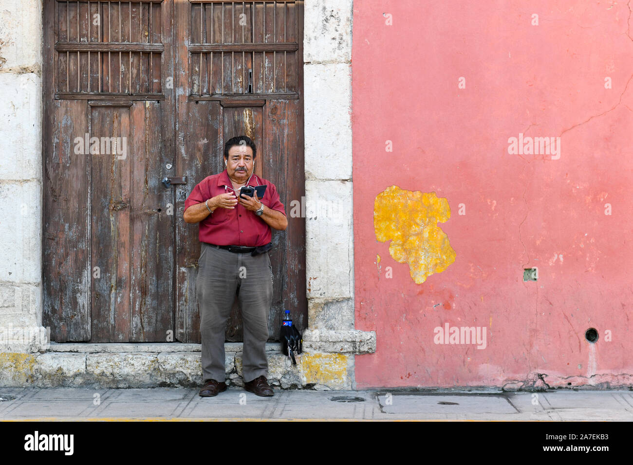 Man on his mobile phone, Merida, Mexico Stock Photo