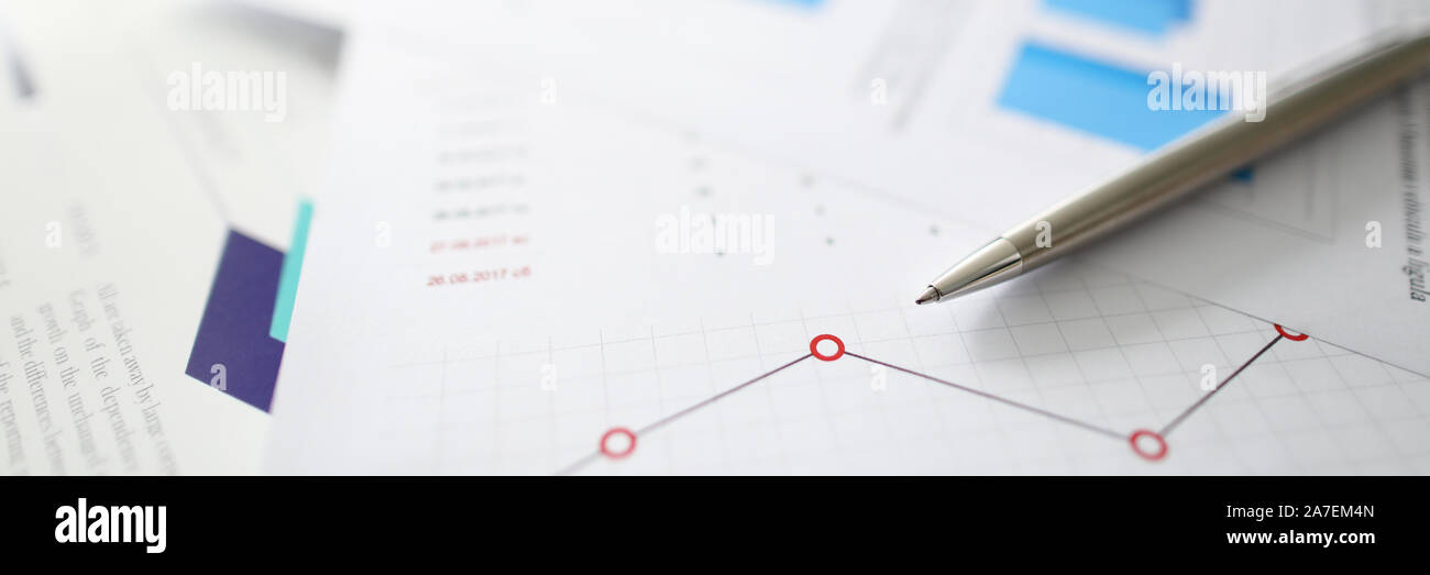 Silver pen lies on documents with Stock Photo