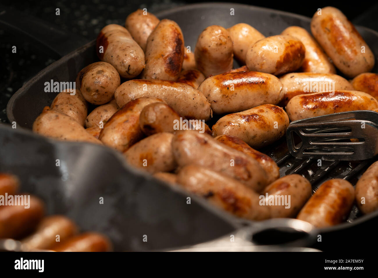 Close up grilled sausages in pan fry. Stock Photo