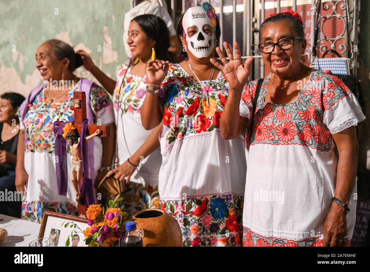 Women in front of their family altar during Hanal Pixan which is the ...