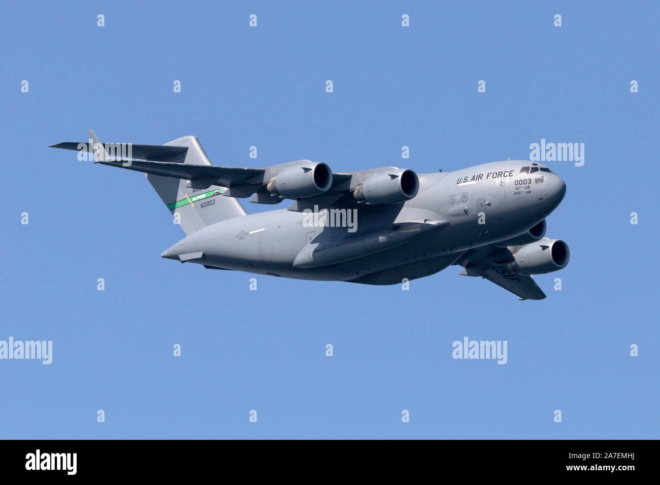 C-17 Globemaster 3 in flight. The Mcdonnell Douglas built military transport has an overall length of 174 feet and a wingspan of 169 feet 9.6 inches. Stock Photo