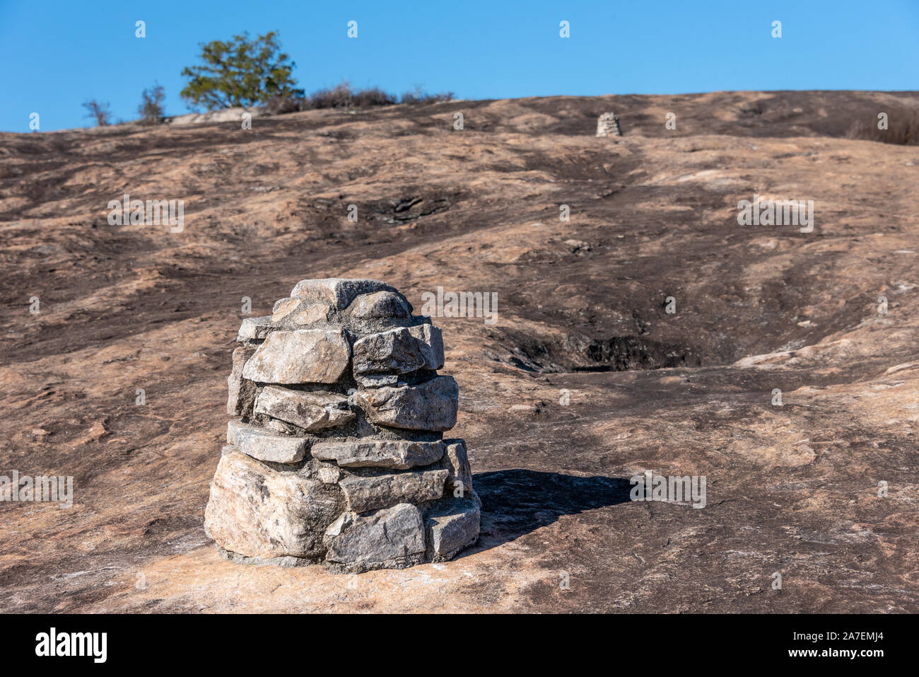 Rock cairn trail markers on the granite monadnock at Arabia Mountain National Heritage Area near Atlanta, Georgia. (USA) Stock Photo