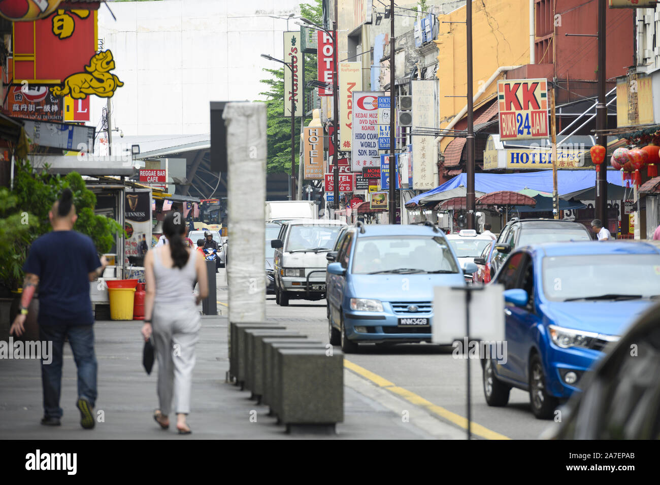 Daily life with traffic and people walking in Petaling Street. Stock Photo
