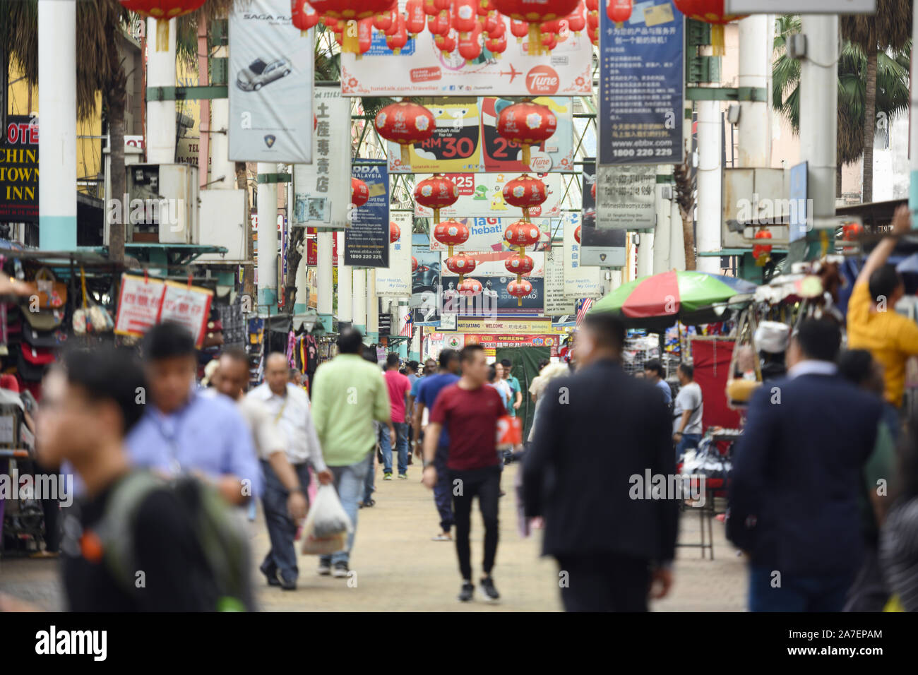 Daily life with traffic and people walking in Petaling Street. Stock Photo