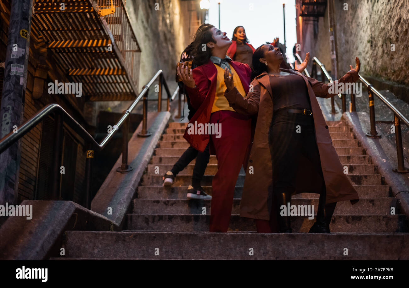 NEW YORK, USA,-NOVEMBER 31,2019: Random people impersonating the Joker and dancing at staircase in the Bronx, New York Stock Photo