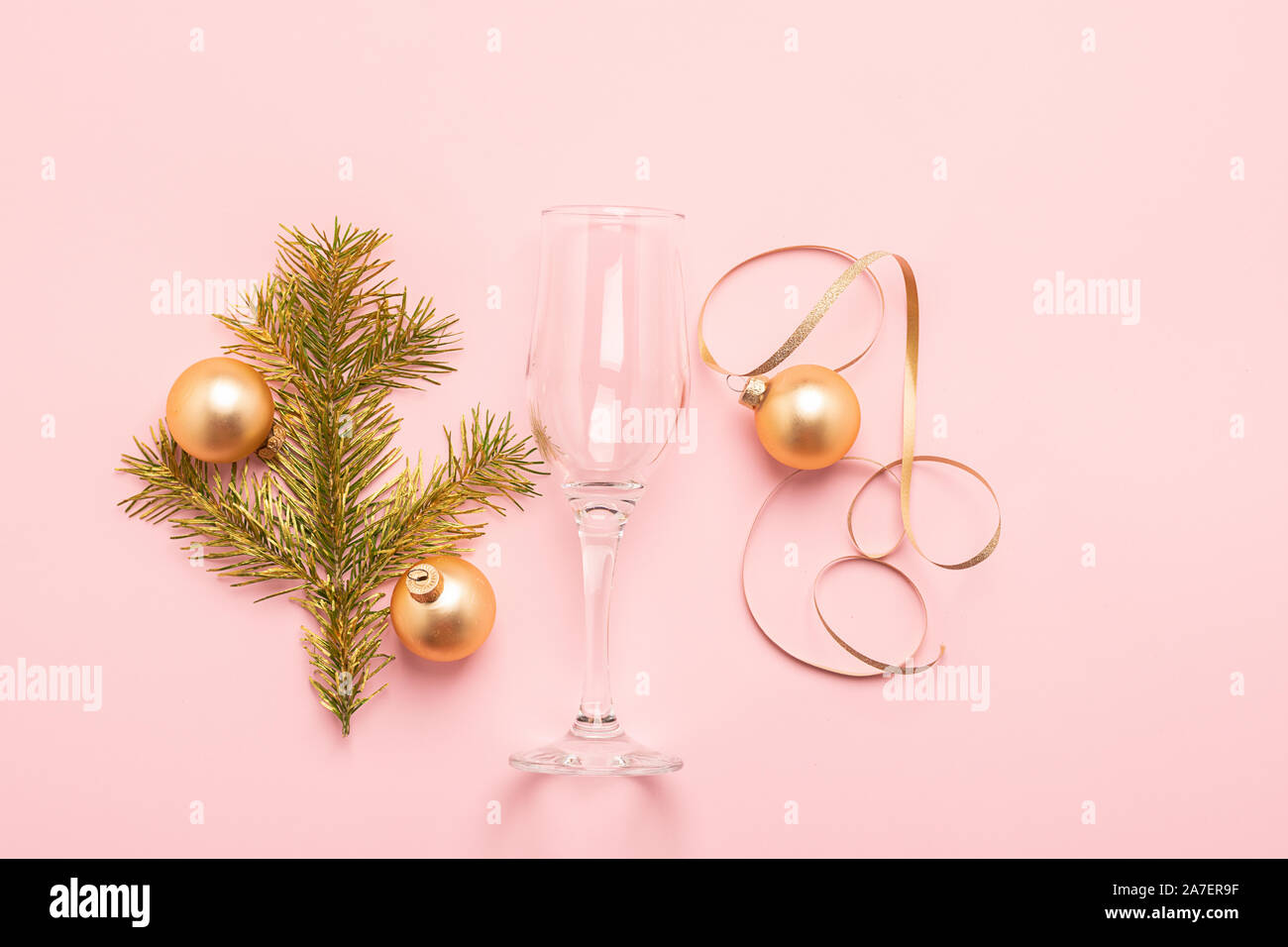 Christmas New Year Layout Balls Glass Goblet Curl Of Serpentine Cork From A Bottle A Branch Of A Spruce Tree Of Gold Color On A Pink Background Holi Stock Photo Alamy