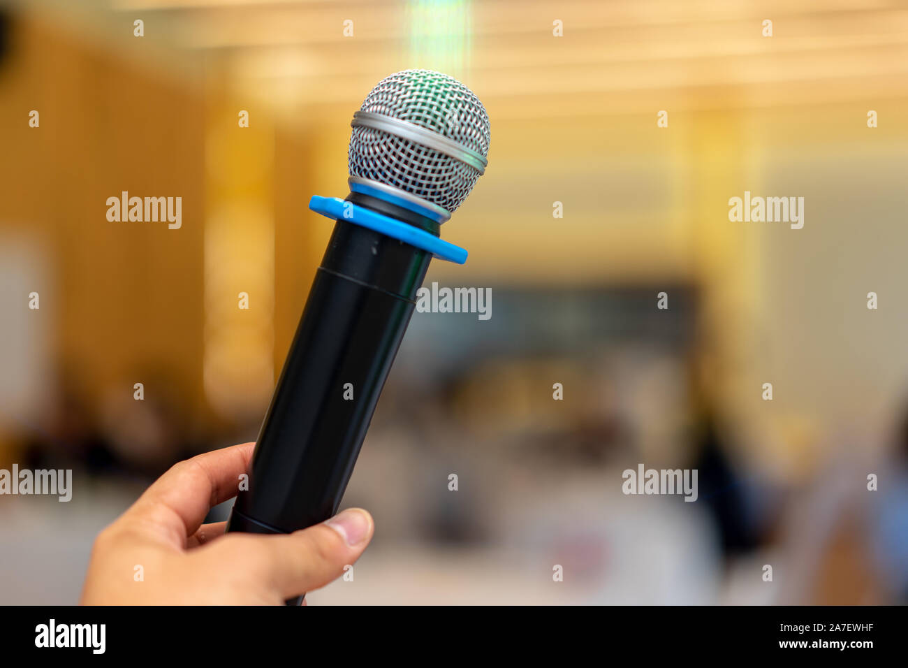 close up wireless mic in the seminar classroom with blur students ...