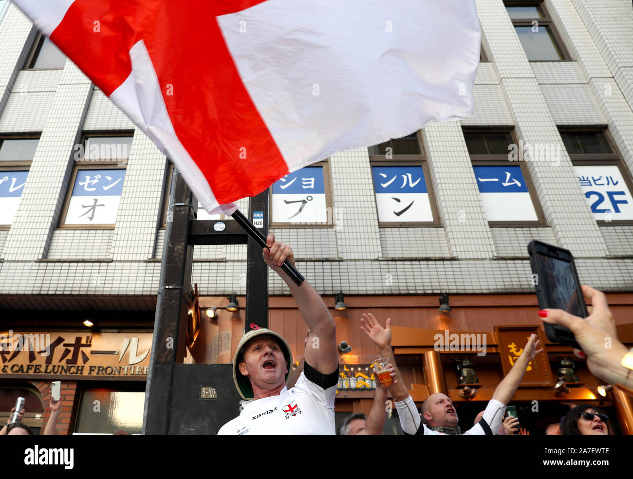 England fans show their support ahead of the 2019 Rugby World Cup final match at Yokohama Stadium. Stock Photo