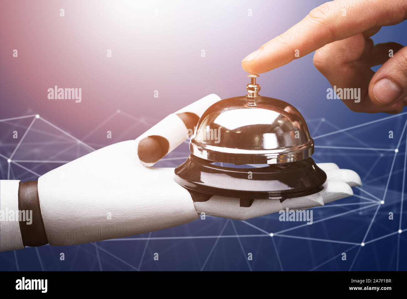 Close-up Of A Person Ringing Service Bell Hold By Robot Against Technology Background Stock Photo