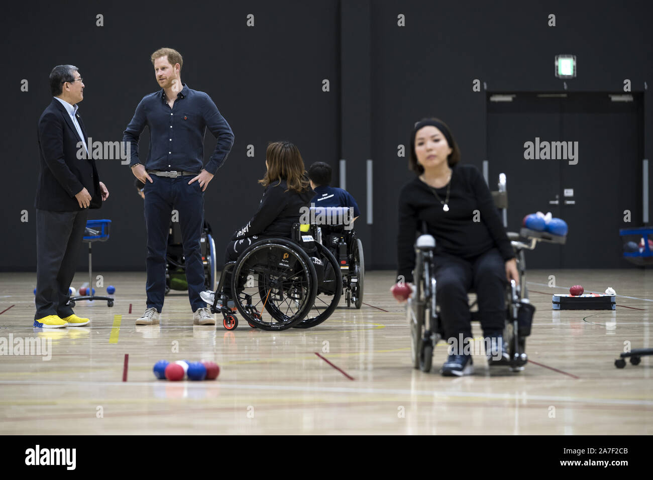 The Duke of Sussex speaks with Nippon Foundation Support Center Chairman Yasushi Yamawaki (left) as they watch a boccia training session at the Nippon Foundation Para Arena in Tokyo, Japan. Stock Photo