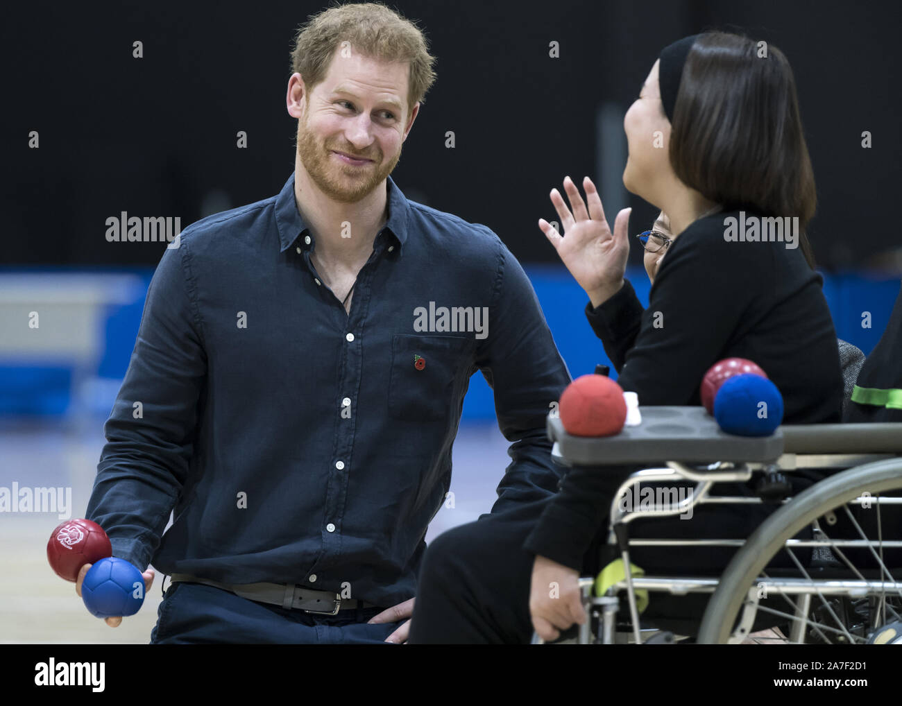 The Duke of Sussex speaks to a boccia athlete as he visits the Nippon Foundation Para Arena in Tokyo, Japan. Stock Photo