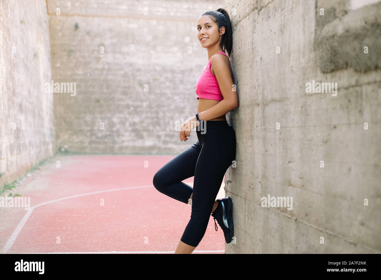 Wall Side View Woman Leaning Against Wall / Redheaded beautiful woman