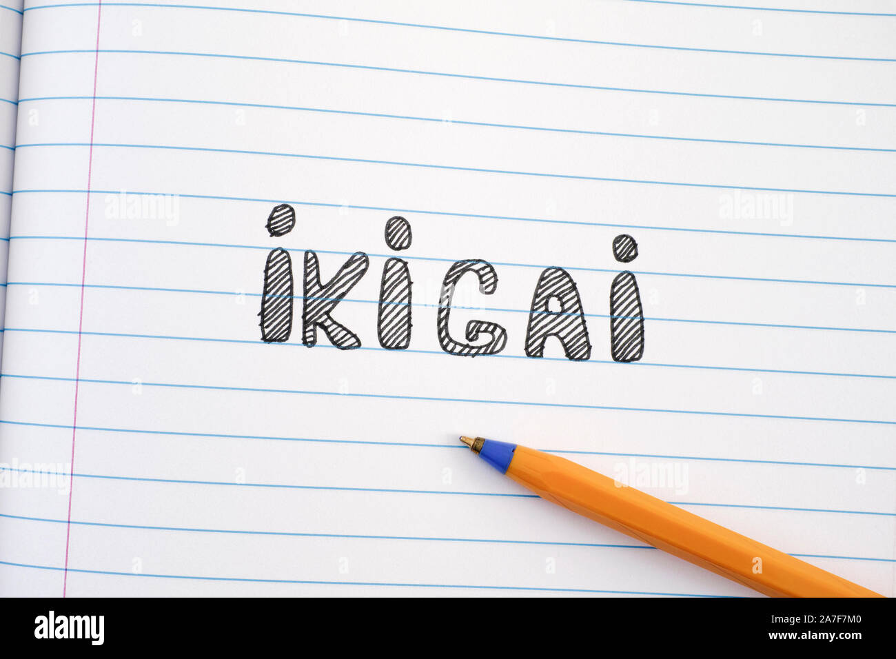 The word Ikigai on notebook sheet and pen. IKIGAI is a Japanese concept reason for being Stock
