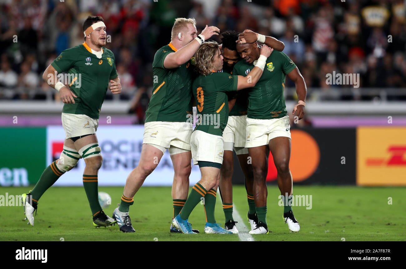 South Africa's Makazole Mapimpi (right) celebrates with team-mates ...