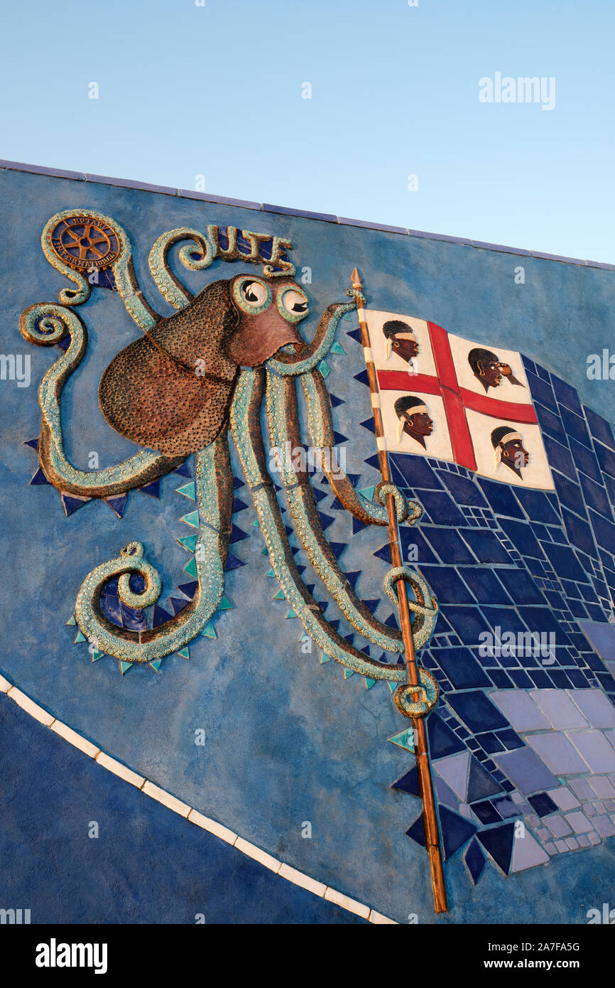 The Sardinian flag of  Four Moors incorporated into a harbour wall mural in La Caletta Nuoro Sardinia Italy Europe Stock Photo