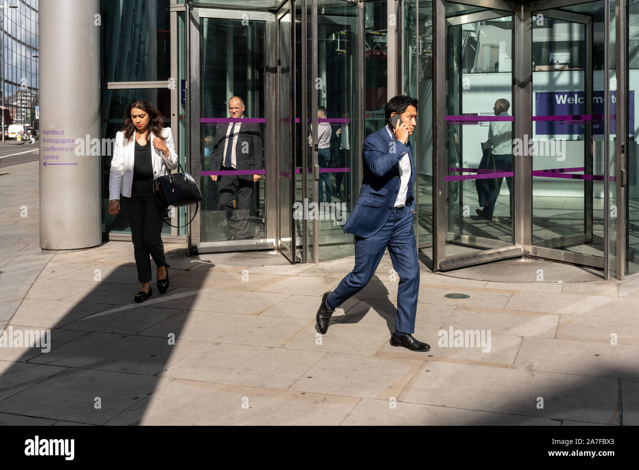 Bishopsgate. Office workers going about their daily business, London UK Stock Photo
