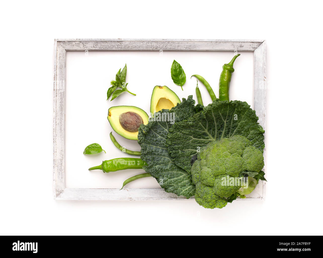 Green vegetables inside frame on white background Stock Photo Alamy