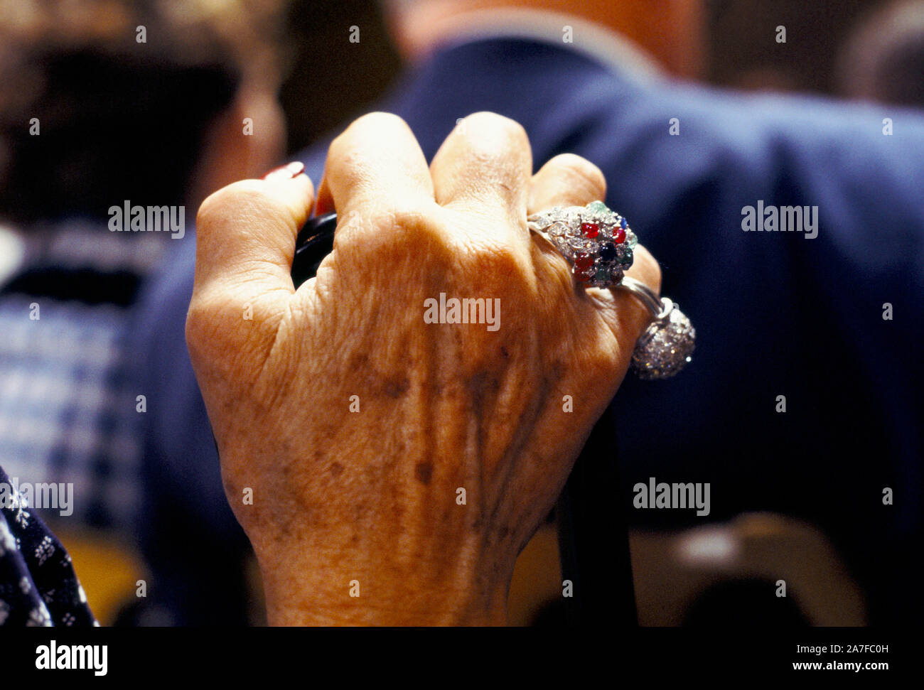 Wealthy older senior woman hand with rings at the  Sothebys auction 1970s, of the Robert Von Hirsch fine art collection sale at their Bond Street London auction house. 1978. Peter Wilson auctioneer chairman UK HOMER SYKES Stock Photo