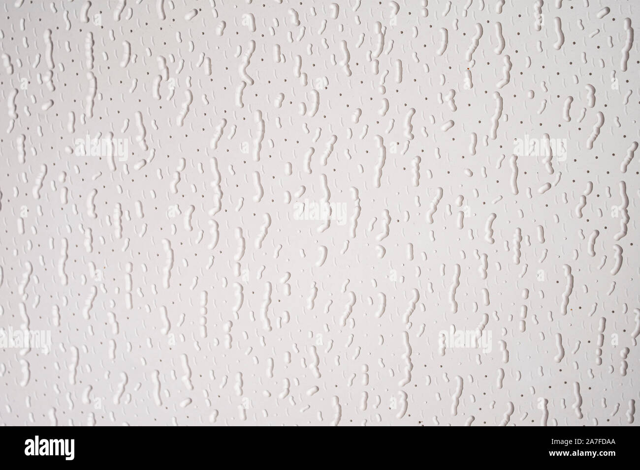 Embossed and shaded vertical worms pattern with stripes and dots Stock Photo