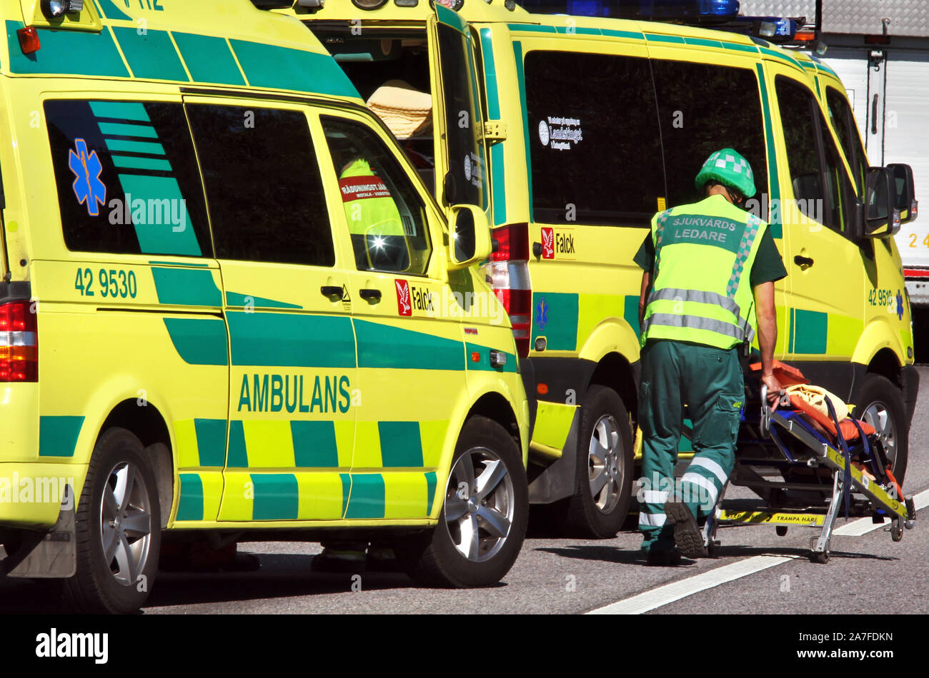 An ambulance nurse at an ambulance during an accident. Photo Jeppe Gustafsson Stock Photo