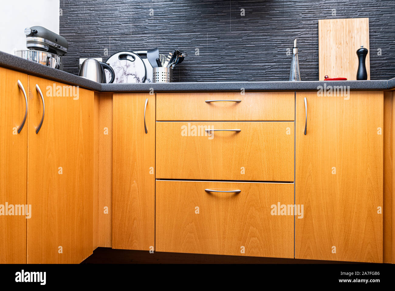 Small wooden drawers, part of wooden furniture in kitchen Stock Photo -  Alamy