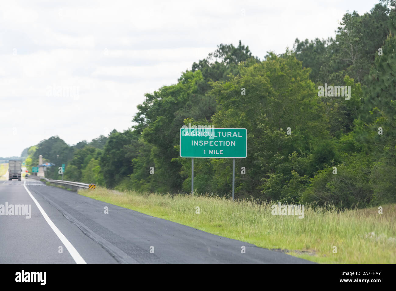 Mobile, Alabama city highway interstate 10 and sign for agricultural inspection station in one mile exit Stock Photo