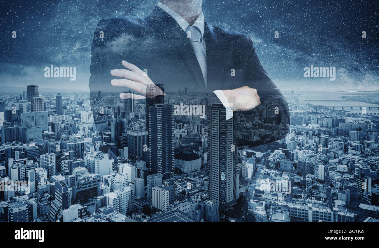 Businessman arm crossed, with Double exposure blue city at night Stock Photo