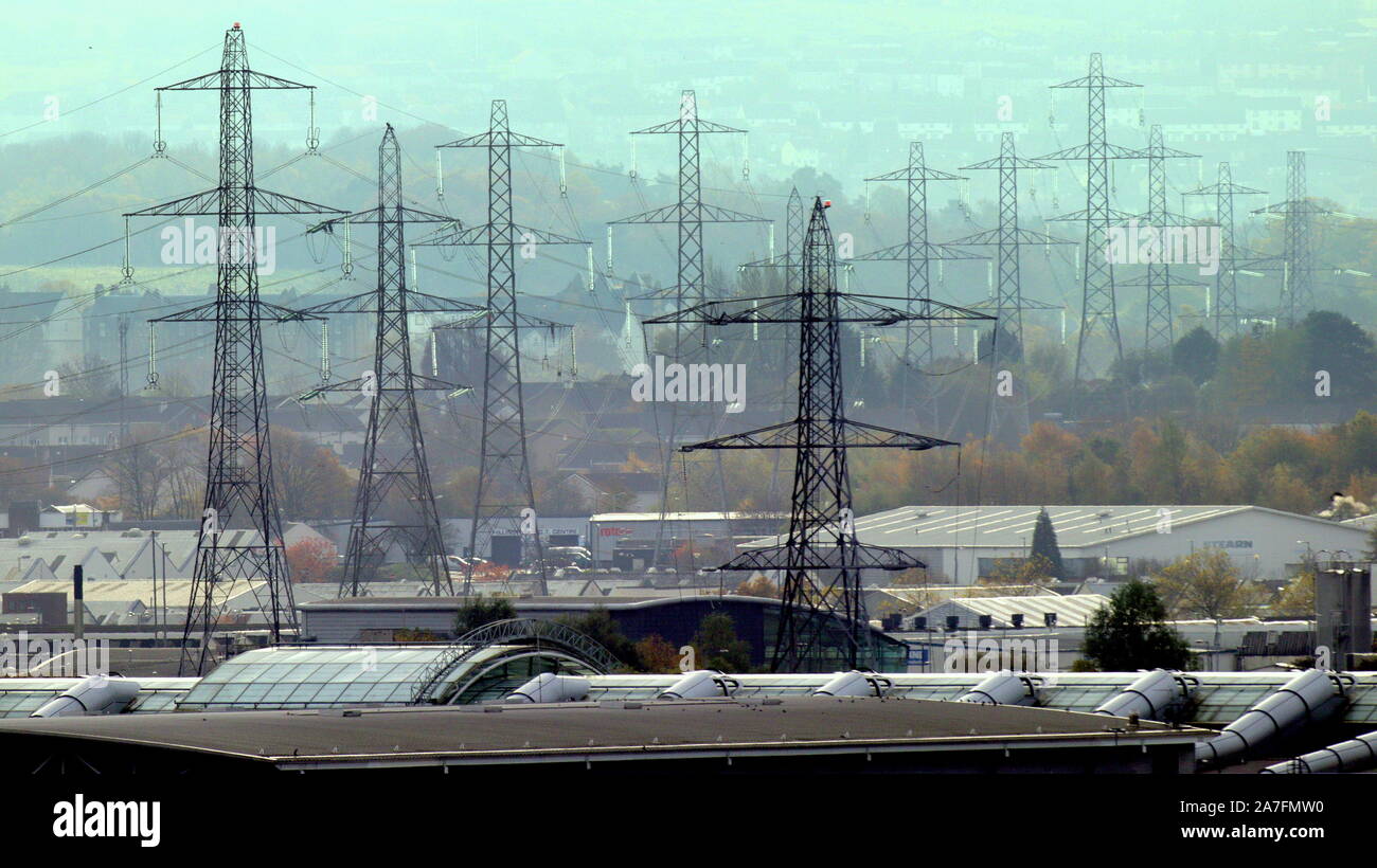 Glasgow, Scotland, UK 2nd November, 2019. UK Weather: Autumn moves to winter as rainfall results in limited visibility as local landmarks  the electrical pylons of braehead with the intu shopping centre roof in the foreground . Gerard Ferry/ Alamy Live News Stock Photo
