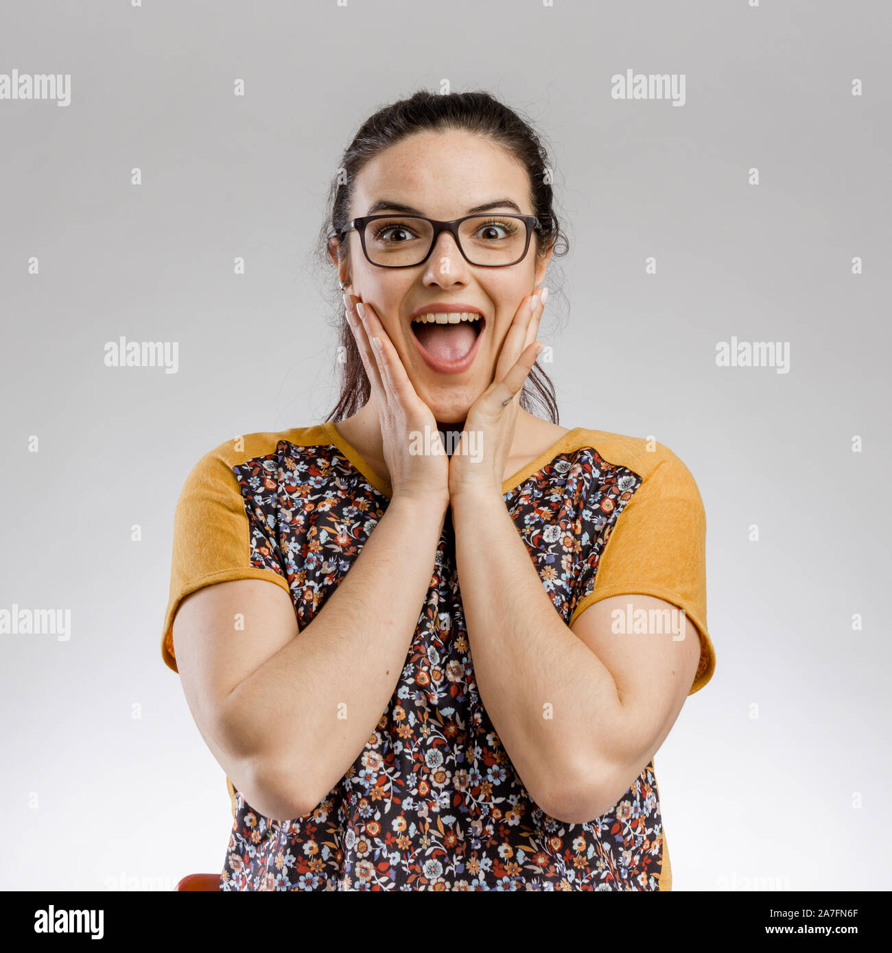 Portrait of woman making a happy face Stock Photo