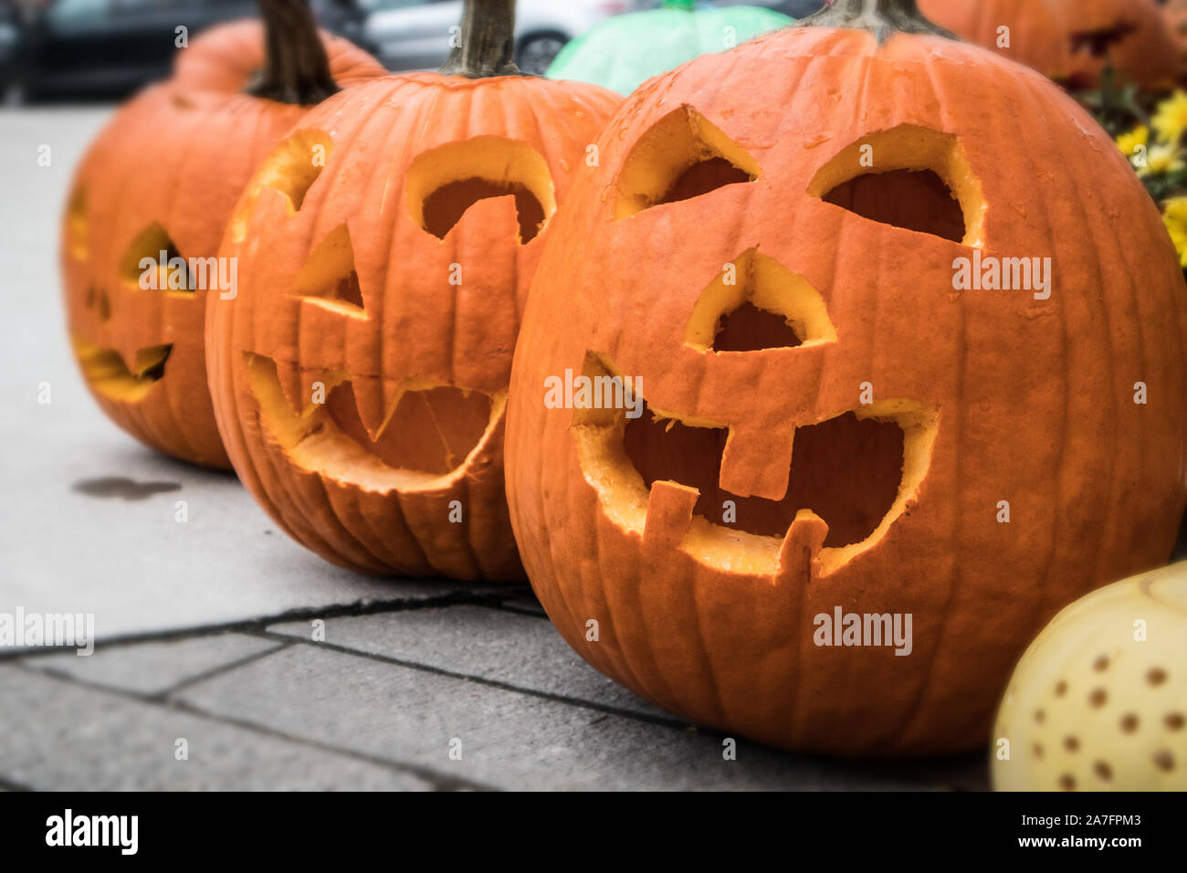 Scary monsters carved in the Halloween pumpkins.. Stock Photo