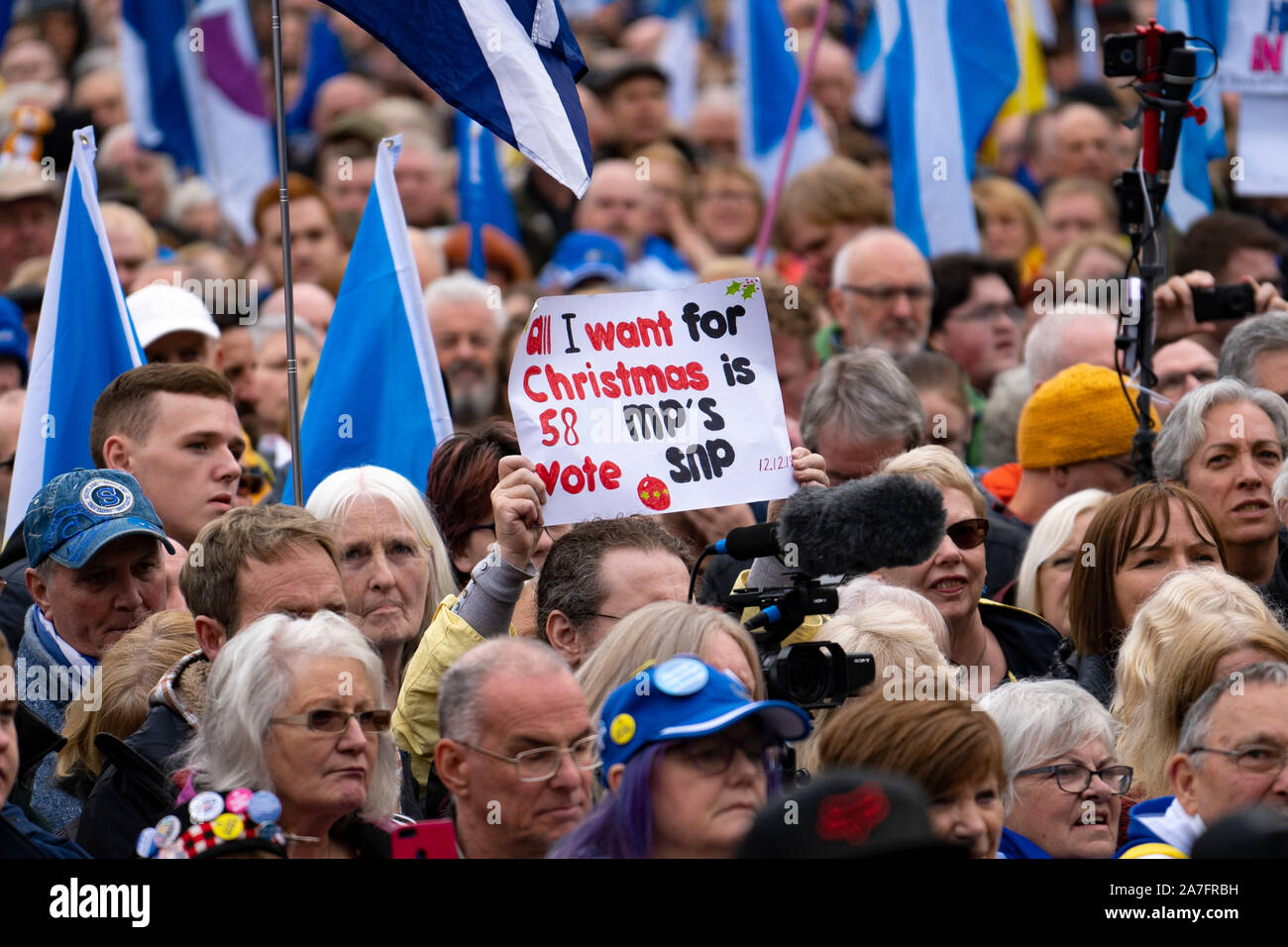 Glasgow, Scotland, UK. 2nd November 2019. Supporters of Scottish nationalism attend a rally in George Square Glasgow. The rally was organised by The National newspaper, the Scottish pro-Nationalism newspaper. First Minister Nicola Sturgeon addressed the rally. Pictured. Sign suggests SNPO have 58 MPs at Scottish Parliament , in fact they have 59 currently.Iain Masterton/Alamy Live News. Credit: Iain Masterton/Alamy Live News Stock Photo