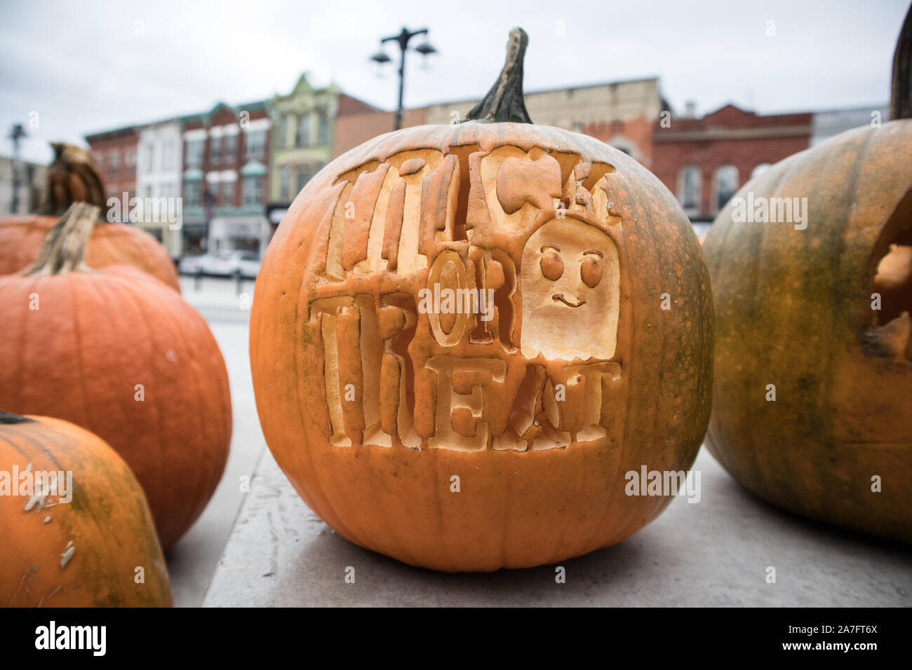 'Trick or treat' is carved out from a Halloween pumpkin. Stock Photo